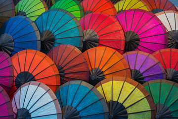 Laos, Luang Prabang. Parasols made of natural materials of different colors