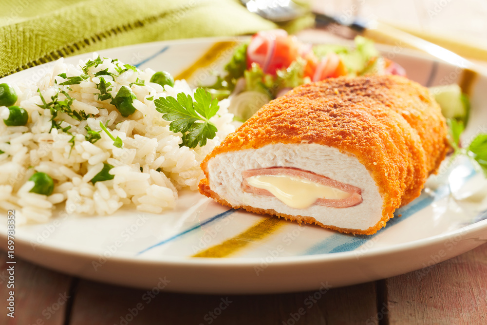 Wall mural Cordon bleu chicken with rice and parsley