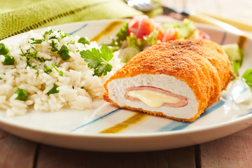 Cordon bleu chicken with rice and parsley