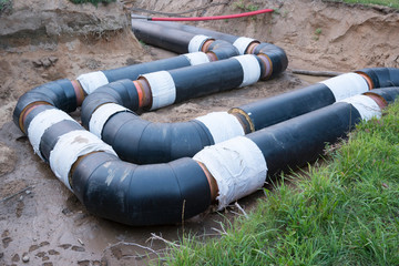 Laying of heating pipeline in the trench to provide new houses with hot water
