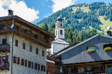 Typical Houses and churches of the mountain village of Sauris