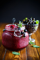 Berry ripe black currant with jam