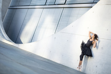 Attractive ballerina posing outdoors