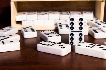 pieces of domino principle concept in black and white effect