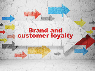 Advertising concept: arrow with Brand and Customer loyalty on grunge wall background