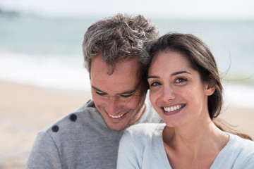 Portrait of a middle-aged couple having fun on the beach