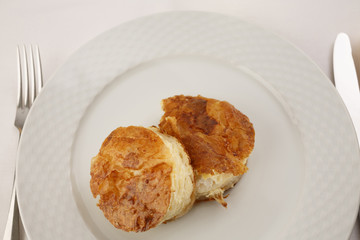 Cheese puff pastry arranged on a plate, Traditional dish in elegant setting, Selective focus with soft light