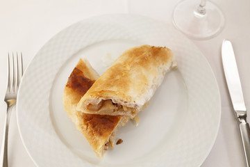 Apple pie slice arranged on a plate, Traditional dessert in elegant setting, Selective focus with soft light