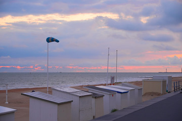 Sunset at the sea, coast cabins