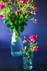 The beautiful vases with flowers  stand on the table