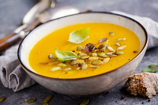 Pumpkin soup with basil leaf
