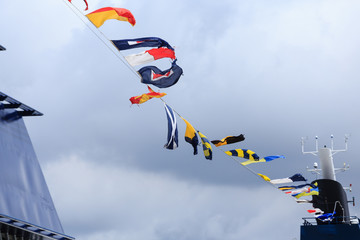 Nautical Flags Under Clouds