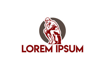 Man with glasses standing on a stone thinking
