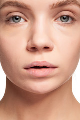 Obraz premium Gorgeous beautiful woman with no make up. Studio photo. Beauty and skin care