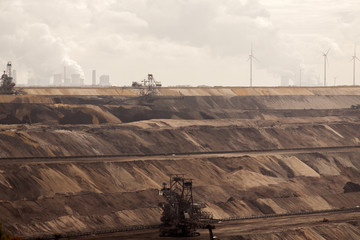 Germany, North Rhine Westphalia, -june 2017:  ground excavator in action moving mullock and soil at open pit coal mine; Germany,for winning brown coal