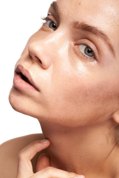 Gorgeous beautiful woman with wet face. Studio photo. Beauty and skin care