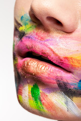 Lips in close up with colors all over the mouth. Beauty and sensuality