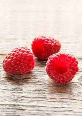 Fresh and sweet raspberries background. Selective focus