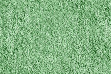 Green color bath towel surface.