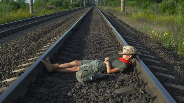 Tourist Relaxing On Rails