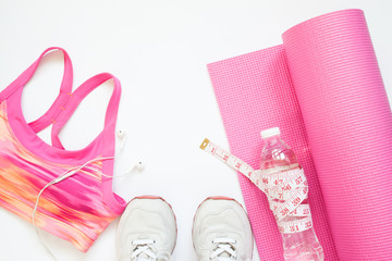 Creative flat lay of sport equipments in pink collection, Gym and workout