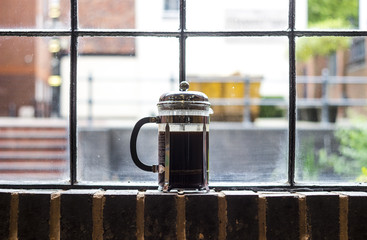 French press on a window sill