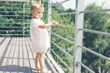 Baby staying on the balcony