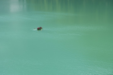 Fototapeta premium Boat on the Braies lake in the Dolomite Alps, Sudtirol, Italy.