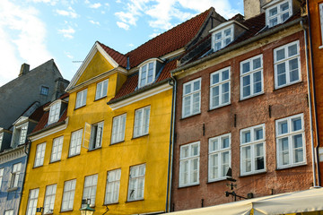 Fototapeta na wymiar Copenhagen Nyhavn (New Harbour), in Copenhagen, Denmark. New port of Copenhagen. Colorful old town architecture. Copenhagen style, European street