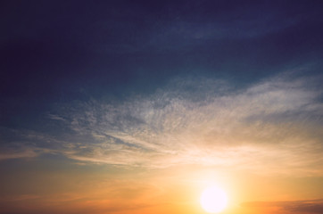The dark blue sky and the sunrise.