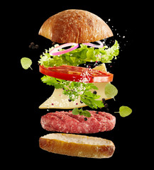 Floating fresh ingredients for a beef burger