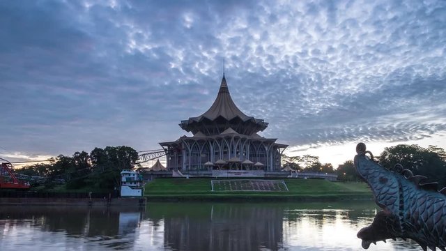 SARAWAK - JUNE 29: A panning down footage of burning sky sunrise with the background view of Sarawak State Legislative Assembly on June 29, 2017 in Sarawak.