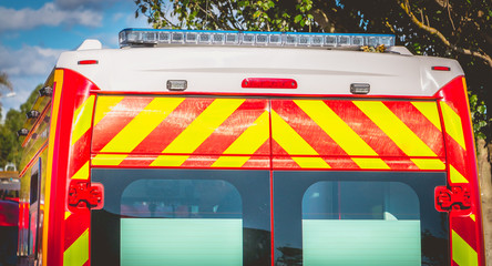 flashing light on a red ambulance firefighters