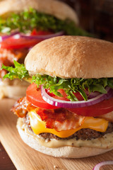 bacon cheese burger with beef patty, tomato, onion