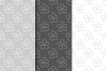 Fototapeta na wymiar Set of floral seamless patterns. Gray backgrounds