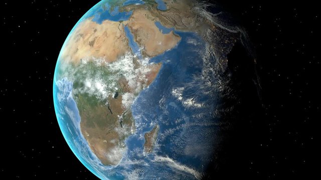 Night to day - rotating Earth. Zoom in on Uganda outlined
