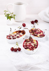 Cherry clafoutis - traditional French sweet fruit dessert.