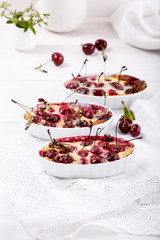 Cherry clafoutis - traditional French sweet fruit dessert.