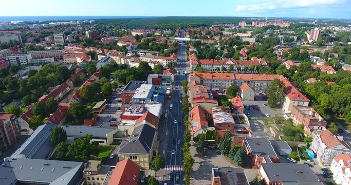 KLAIPEDA, LITHUANIA - AUGUST 28, 2017: AERIAL. Smooth drone flight through Klaipeda City at low altitude