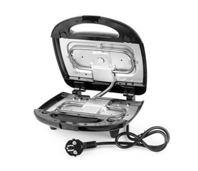 Open waffle iron on a white background with clipping path