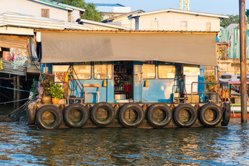 Fototapeta na wymiar Filling station at the riverside of the Chao Phraya river in Bangkok. The station serves the long-tail boats, ferries and express boats as bunkering