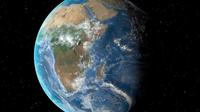 Night to day - rotating Earth. Zoom in on Zambia outlined