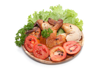 grilled wing and Drumstick chicken on wooden plate isolated on white background