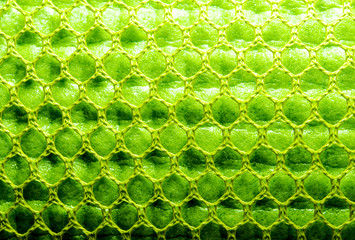 Surface texture of Yoga mat, green sponge mat in the nylon mesh bag