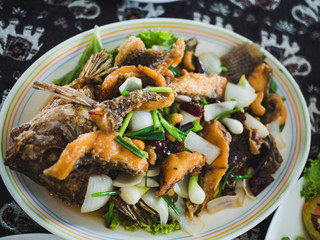 thai food , Deep-fried sea bass with onion, onion, fish sauce