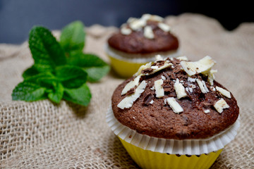 Close-up of Chocolate Muffins on a Rustic Burlap Sack.