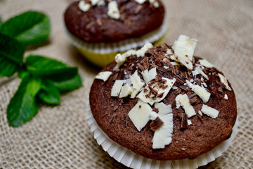 Closeup of Chocolate Muffins on a Rustic Burlap Sack.