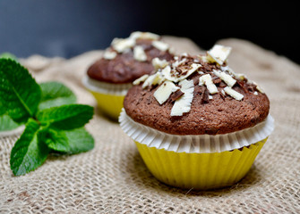 Closeup of Chocolate Muffins on a Rustic Burlap Sack.