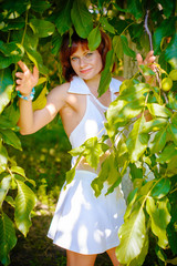 Miniature mature woman resting on nature and enjoying weekend. The concept of harmony with life and with oneself 