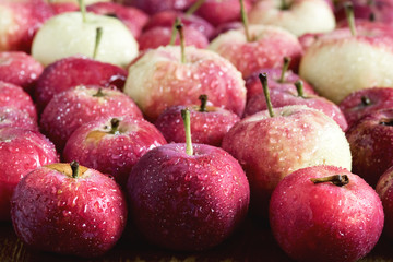 Background with small apples Wooden background Beautiful small apples Harvest background Close up